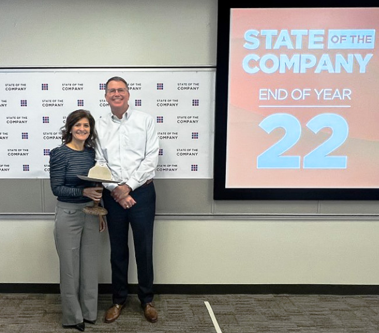 Halff's President/CEO Mark Edwards (right) presented the Stetson Award to Susie Nevitt at the end-of-year State of the Company Dec. 7, 2022.