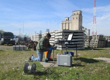 crew member working on equipment near Dallas DART environmental project