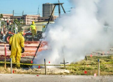 worker in yellow hazmat suit at UT MD Anderson Cancer Center site remediation project