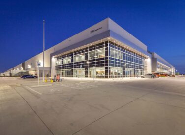 Project Pedregal building at night with lights exterior view