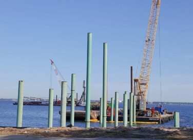 crane laying poles for Pensacola Bay Bridge