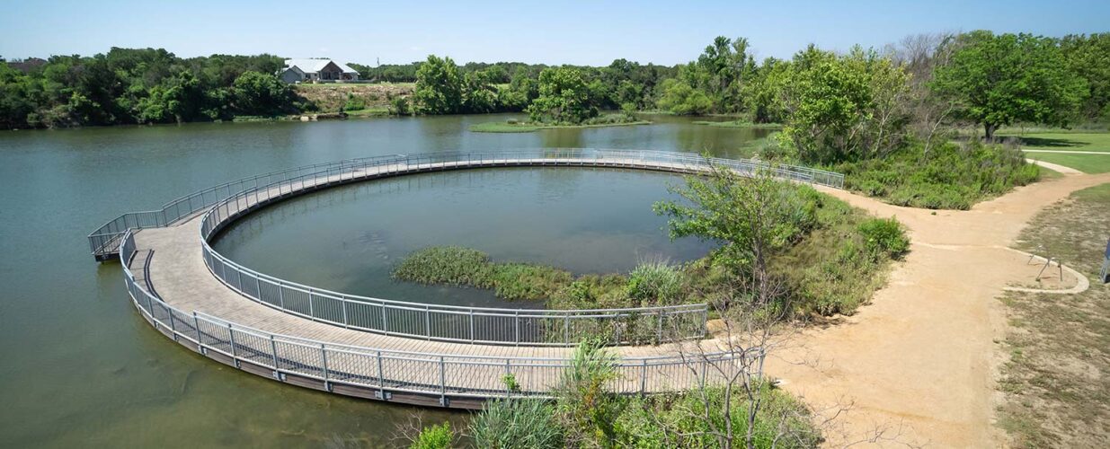 circular bridge walkway over Leander Lakewood Lake