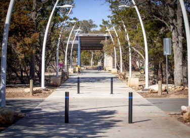 Leander Lake Park walkway with light poles