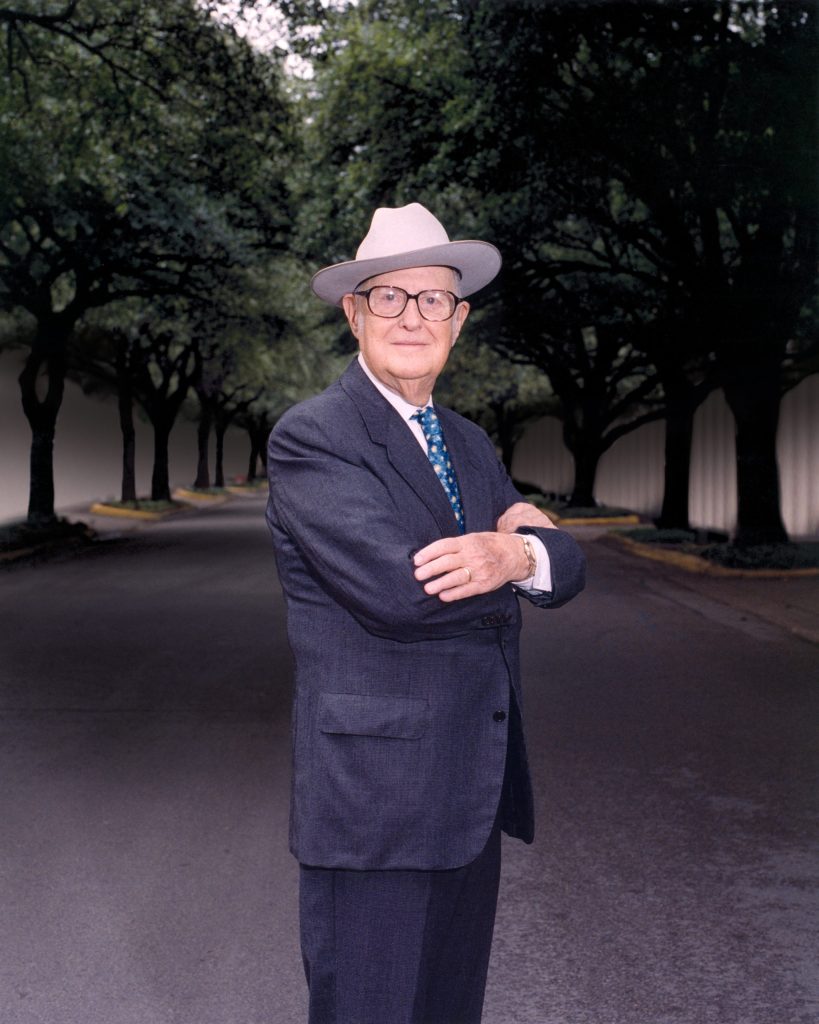 Photo of Halff's founder, Dr. Albert H. Halff, posing with arms crossed wearing his signature Stetson hat