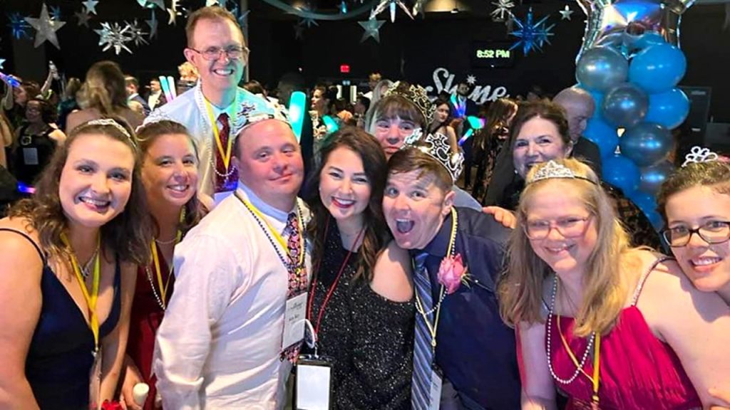 Group photo of people at Night to Shine prom event for special needs people