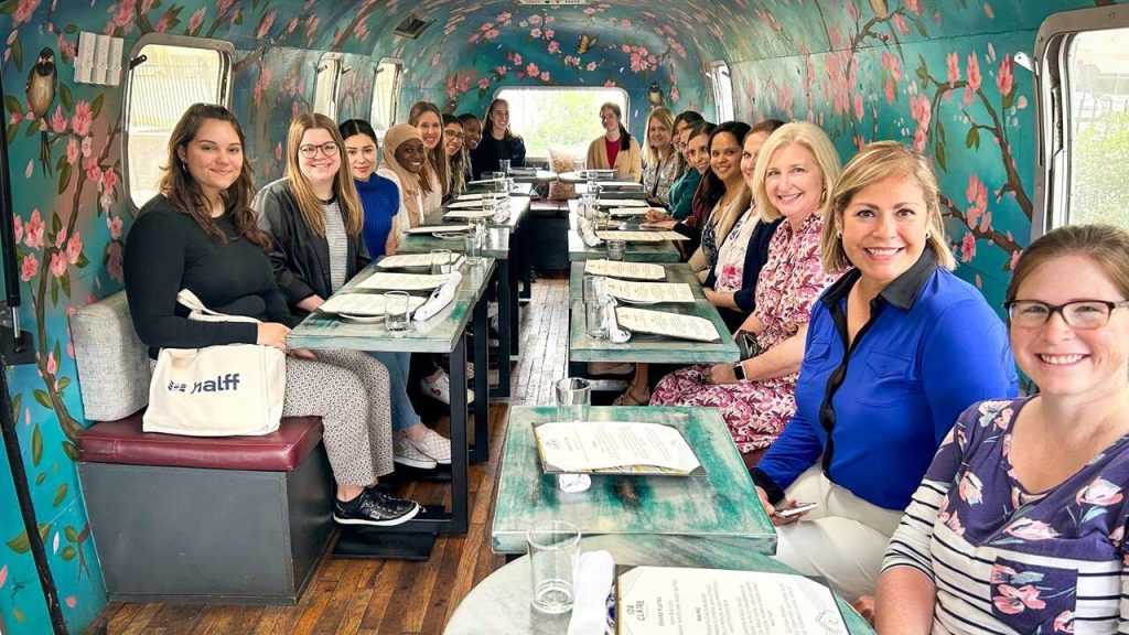 Halff women eating lunch at Ida Clair for International Women's Day