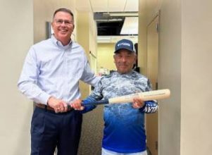 Halff CEO Mark Edwards presenting Home Run Award to Adolfo Vargas
