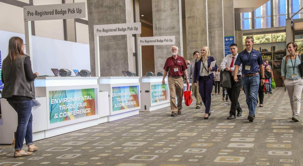 Environmental Trade Fair attendees walking in lobby