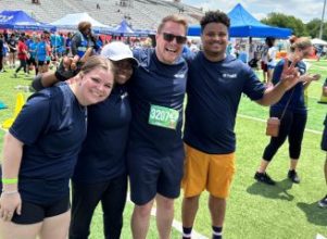 San Antonio employees at Corporate Cup on field 2023