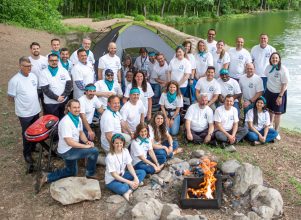 Group photo of Halff's Culture Camp Counselors by outdoor tent for 2023 summer cam sessions