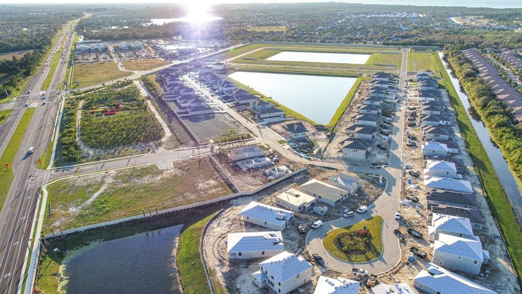 Aerial drone photo of Mangrove Manor residential development during the day