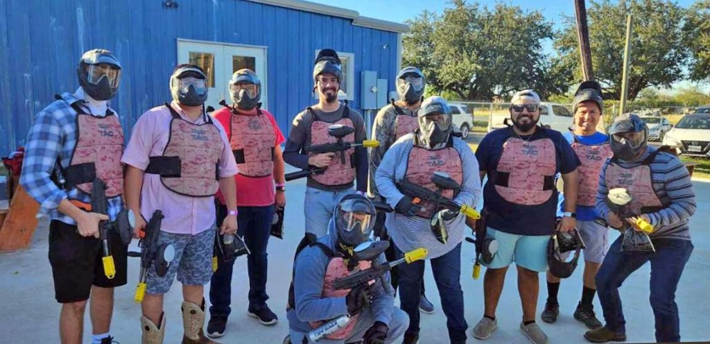 Halff McAllen team playing paintball at Delta Field