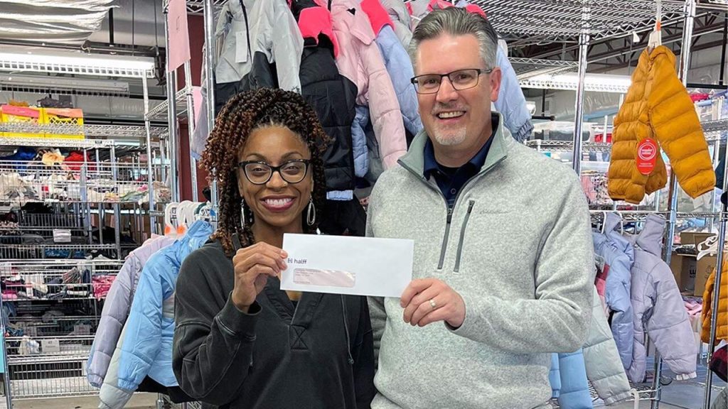 Community Partners receiving HCI check donation in Dallas, TX