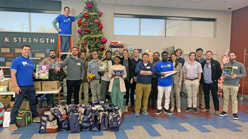 Frisco office volunteering at Frisco Family Services' holiday store setup