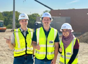 Halff 2023 summer interns at a site visit in safety vests and hard hats